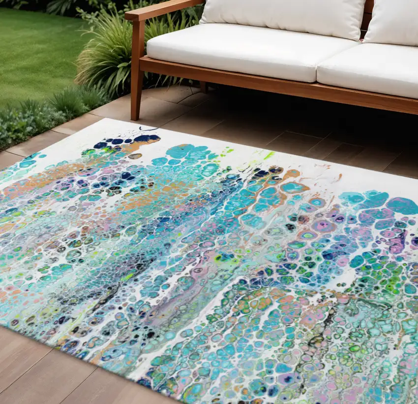Teal Blue Ivory And Gold Abstract Washable Indoor Outdoor Area Rug Photo 1