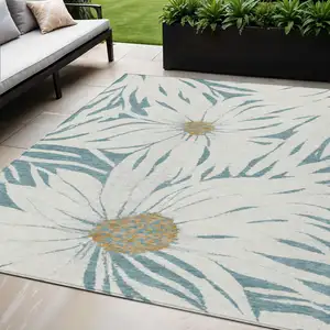 Photo of Teal Blue Ivory And Gold Floral Washable Indoor Outdoor Area Rug