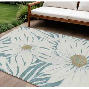 Photo of Teal Blue Ivory And Gold Floral Washable Indoor Outdoor Area Rug