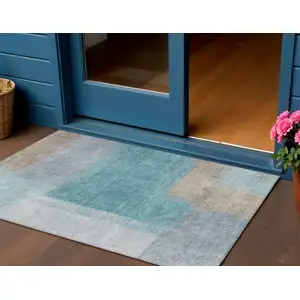 Photo of Teal Blue Ivory And Gray Abstract Washable Indoor Outdoor Area Rug