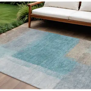 Photo of Teal Blue Ivory And Gray Abstract Washable Indoor Outdoor Area Rug