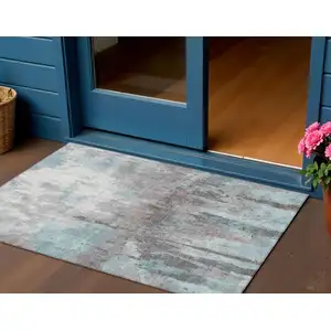 Photo of Teal Blue Ivory And Gray Abstract Washable Indoor Outdoor Area Rug