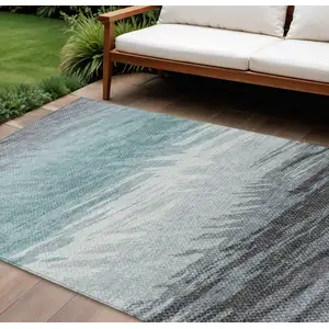 Photo of Teal Blue Ivory And Gray Striped Washable Indoor Outdoor Area Rug