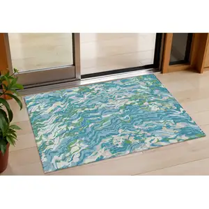 Photo of Teal Blue Ivory And Green Abstract Washable Indoor Outdoor Area Rug