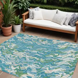 Photo of Teal Blue Ivory And Green Abstract Washable Indoor Outdoor Area Rug
