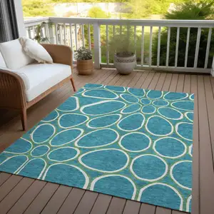 Photo of Teal Blue Ivory And Green Abstract Washable Indoor Outdoor Area Rug