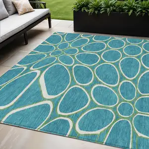 Photo of Teal Blue Ivory And Green Abstract Washable Indoor Outdoor Area Rug