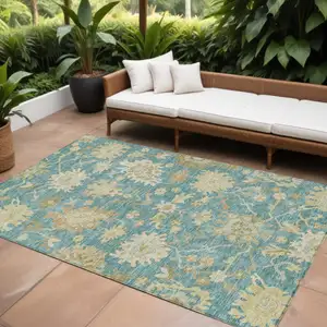 Photo of Teal Blue Ivory And Green Floral Washable Indoor Outdoor Area Rug