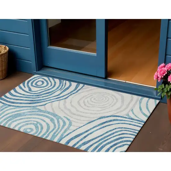 Teal Blue Ivory And Silver Abstract Washable Indoor Outdoor Area Rug Photo 1