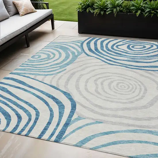 Teal Blue Ivory And Silver Abstract Washable Indoor Outdoor Area Rug Photo 1