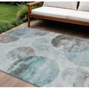 Photo of Teal Blue Ivory And Taupe Abstract Washable Indoor Outdoor Area Rug