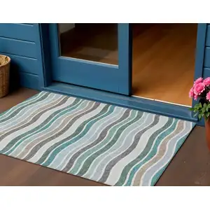 Photo of Teal Blue Khaki And Ivory Striped Washable Indoor Outdoor Area Rug