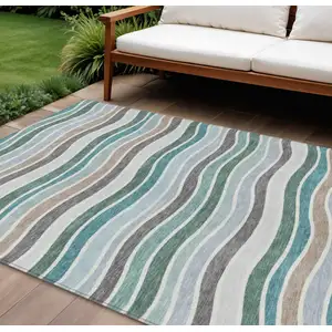 Photo of Teal Blue Khaki And Ivory Striped Washable Indoor Outdoor Area Rug