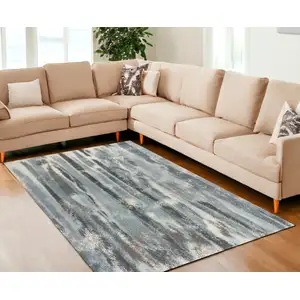 Photo of Teal Blue Machine Woven Abstract Stripes Indoor Area Rug
