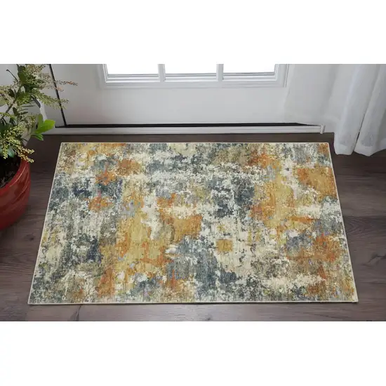Teal Blue Orange Gold Grey Tan Brown And Beige Abstract Printed Stain Resistant Non Skid Area Rug Photo 1