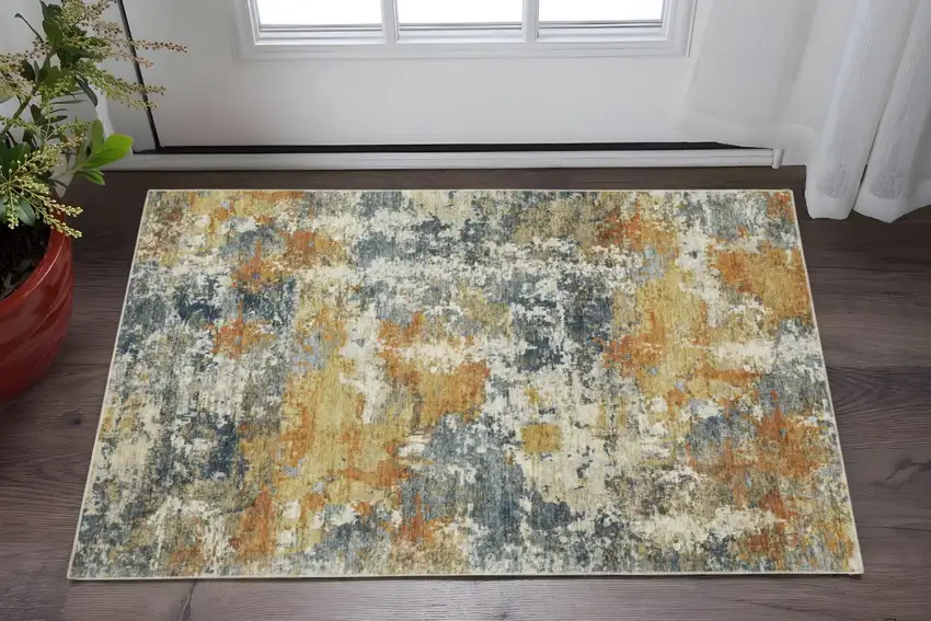 Teal Blue Orange Gold Grey Tan Brown And Beige Abstract Printed Stain Resistant Non Skid Area Rug Photo 1