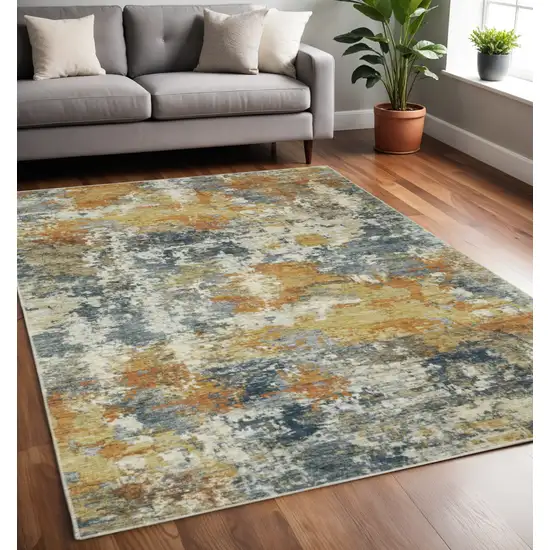 Teal Blue And Gold Abstract Distressed Area Rug Photo 1