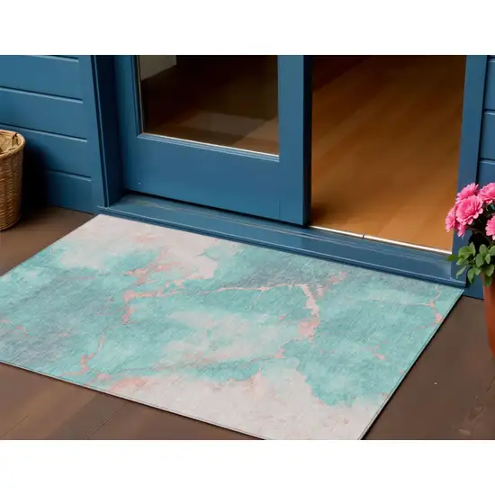 Teal Blue Peach And Ivory Abstract Washable Indoor Outdoor Area Rug Photo 2