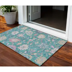 Photo of Teal Blue Pink And Ivory Floral Washable Indoor Outdoor Area Rug