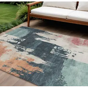 Photo of Teal Blue Pink And Orange Abstract Washable Indoor Outdoor Area Rug