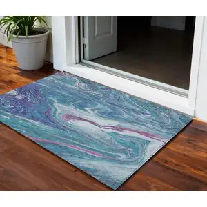 Photo of Teal Blue Purple And Pink Abstract Washable Indoor Outdoor Area Rug