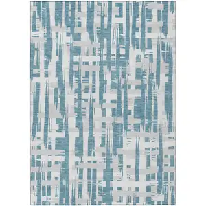 Photo of Teal Blue Silver And Ivory Striped Washable Indoor Outdoor Area Rug