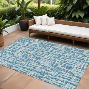 Photo of Teal Blue Sky Blue And Ivory Abstract Washable Indoor Outdoor Area Rug