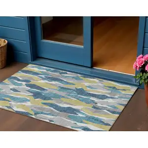 Photo of Teal Blue Yellow And Ivory Striped Washable Indoor Outdoor Area Rug