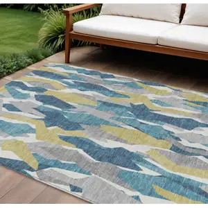 Photo of Teal Blue Yellow And Ivory Striped Washable Indoor Outdoor Area Rug