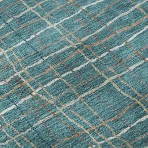 Photo of Teal Brown And Ivory Striped Washable Area Rug With UV Protection