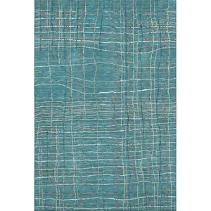 Photo of Teal Brown And Ivory Striped Washable Area Rug With UV Protection