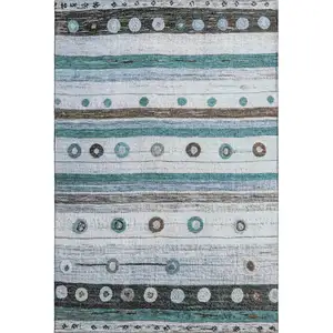 Photo of Teal Brown And Ivory Striped Washable Area Rug With UV Protection