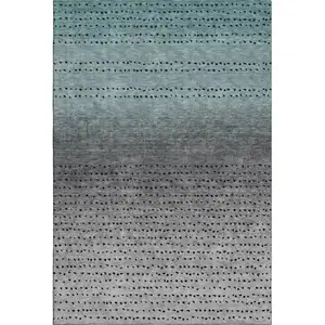 Photo of Teal Charcoal And Gray Abstract Washable Area Rug With UV Protection