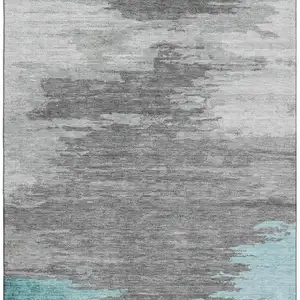 Photo of Teal Charcoal And Gray Abstract Washable Area Rug With UV Protection