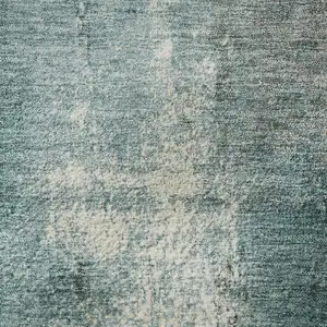 Photo of Teal Charcoal And Ivory Abstract Washable Area Rug With UV Protection
