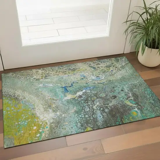 Teal Gold And Gray Abstract Washable Area Rug With UV Protection Photo 1