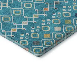 Photo of Teal Gold And Green Southwestern Washable Area Rug With UV Protection