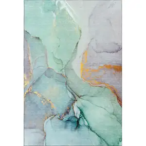 Photo of Teal Gold And Ivory Abstract Washable Area Rug With UV Protection