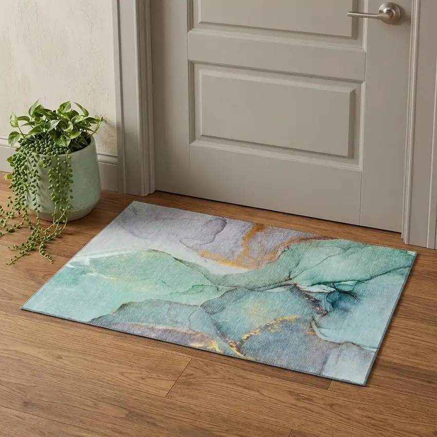 Teal Gold And Ivory Abstract Washable Area Rug With UV Protection Photo 1