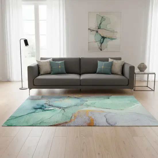 Teal Gold And Ivory Abstract Washable Area Rug With UV Protection Photo 1