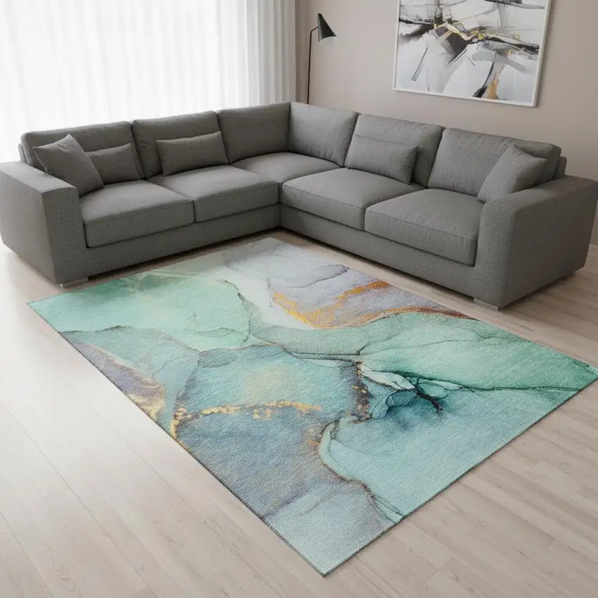 Teal Gold And Ivory Abstract Washable Area Rug With UV Protection Photo 1