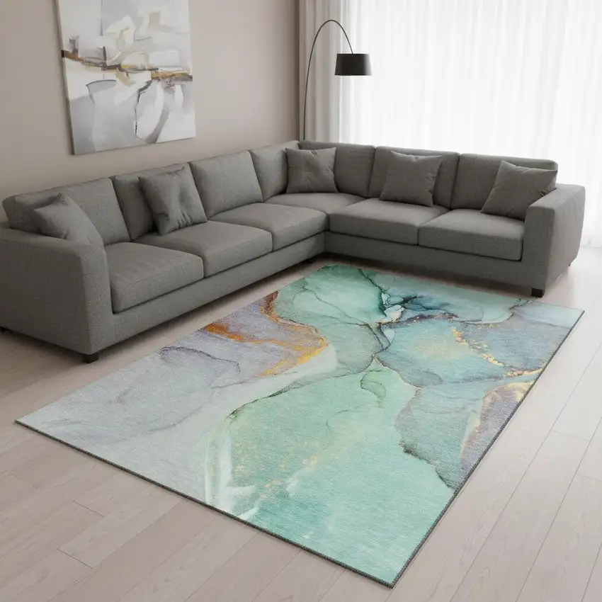 Teal Gold And Ivory Abstract Washable Area Rug With UV Protection Photo 1