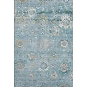 Photo of Teal Gold And Ivory Oriental Washable Area Rug With UV Protection