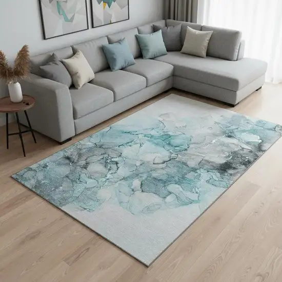 Teal Gray And Ivory Abstract Washable Area Rug With UV Protection Photo 1