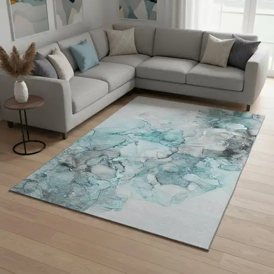 Teal Gray And Ivory Abstract Washable Area Rug With UV Protection Photo 1