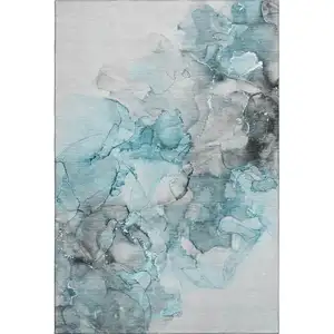 Photo of Teal Gray And Ivory Abstract Washable Area Rug With UV Protection