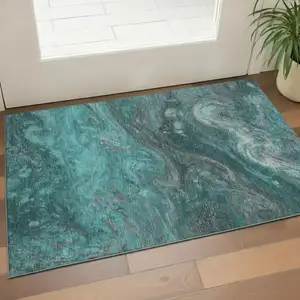 Photo of Teal Gray And Ivory Abstract Washable Area Rug With UV Protection