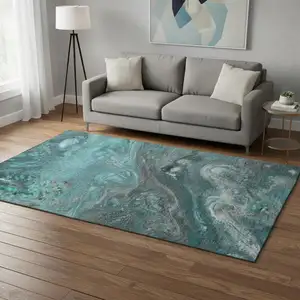 Photo of Teal Gray And Ivory Abstract Washable Area Rug With UV Protection