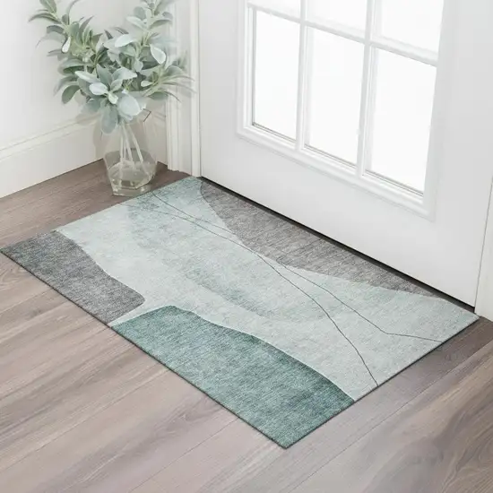 Teal Gray And Ivory Abstract Washable Area Rug With UV Protection Photo 1