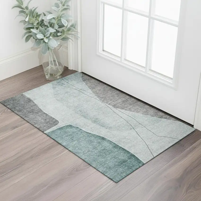 Teal Gray And Ivory Abstract Washable Area Rug With UV Protection Photo 1